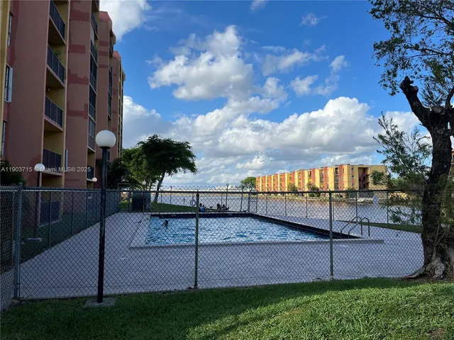 a view of a yard with a bench