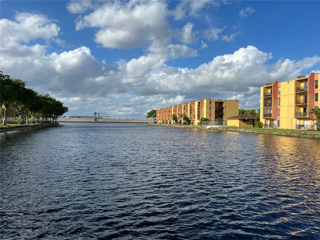 a view of swimming pool with yard and seating area