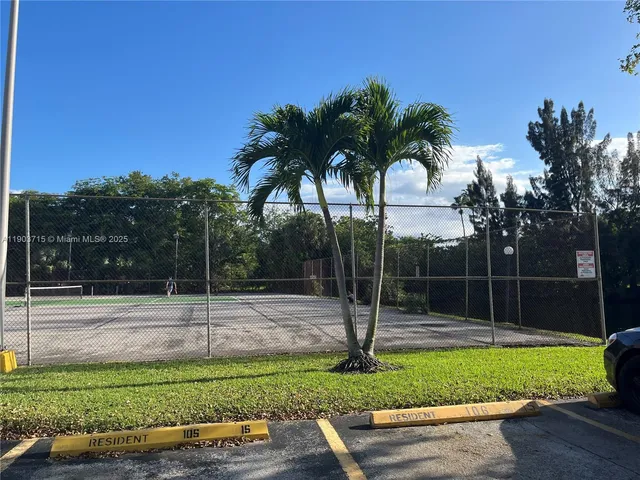 a view of a backyard with sitting area