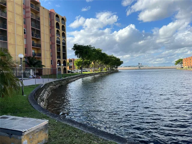 a view of a lake with a building in the background