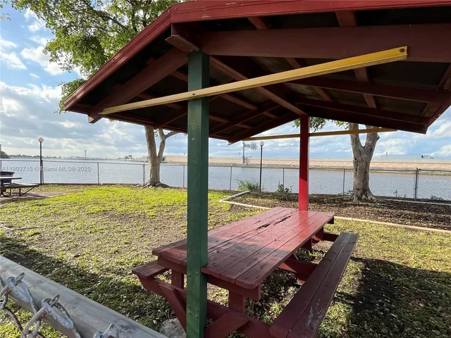 a view of a park with swings and slides