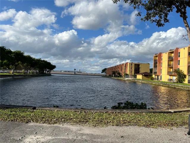 a view of swimming pool outdoor seating and lake