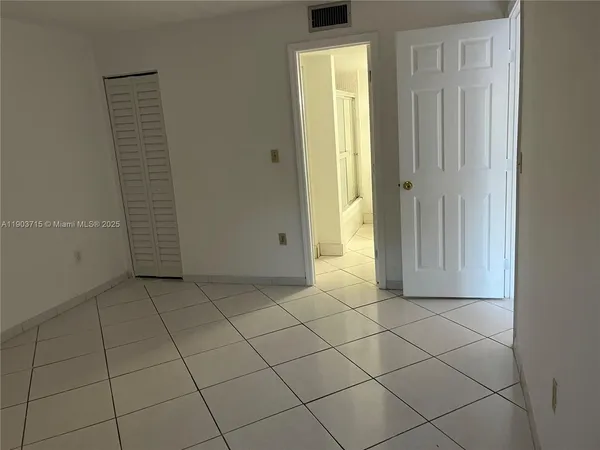 an empty room with cabinet