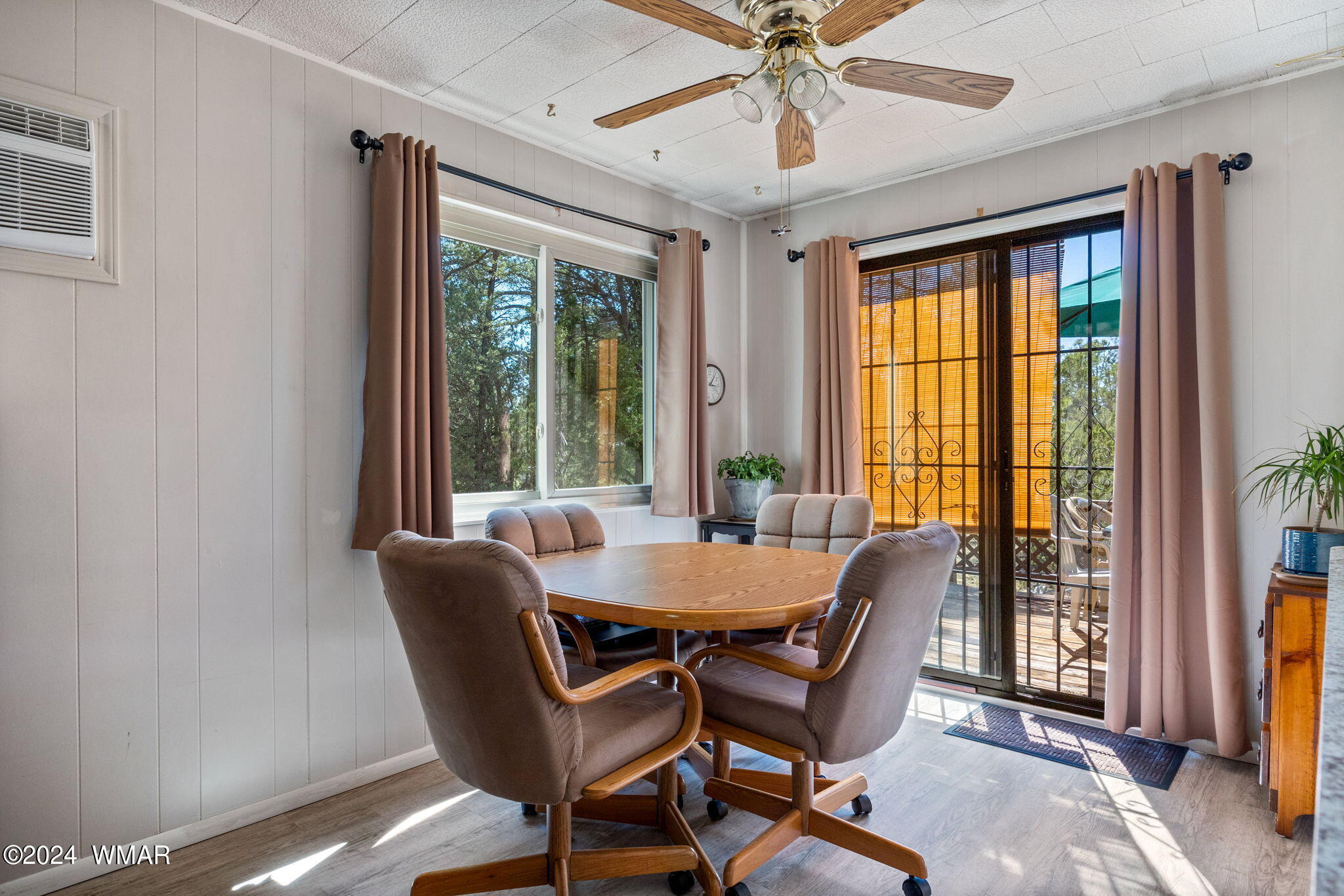 2055 Cherokee Strip Road Overgaard, AZ 85933 - Photo 7 of 35 a dining room with furniture window and wooden floor