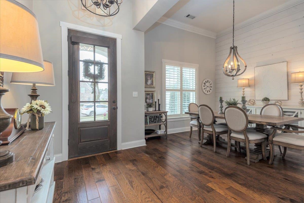 608 Cypress Run Cove Collierville, TN 38017 - Photo 4 of 40 Foyer featuring suspended lighting, crown molding, and dark wood finished floors