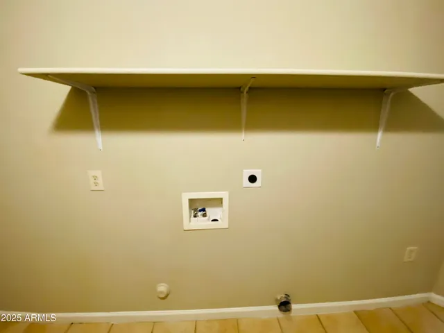 an empty room with a ceiling fan and window