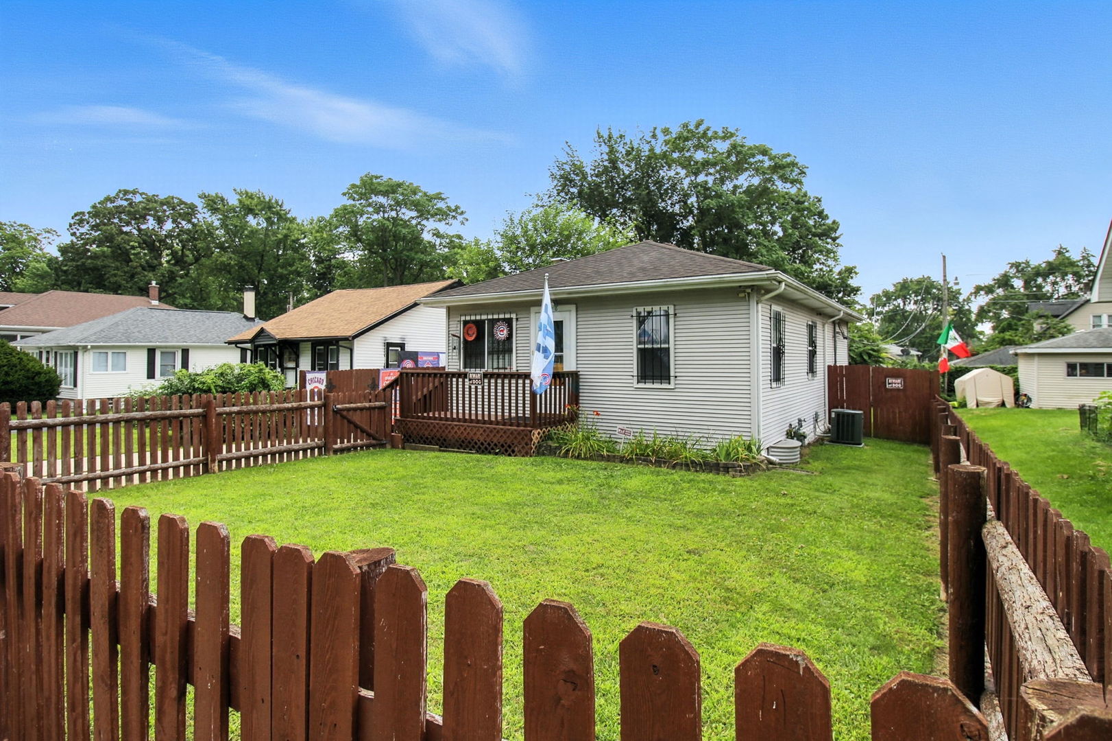 818 Morgan Street Joliet, IL 60436 - Photo 1 of 22 a view of an house with backyard space and garden
