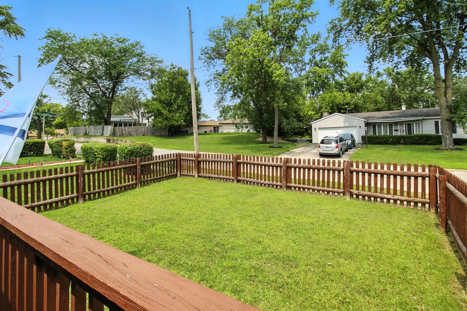 818 Morgan Street Joliet, IL 60436 - Photo 19 of 22 a view of a deck with a big yard and large trees