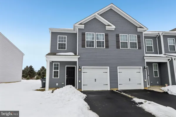a front view of a house with a garage