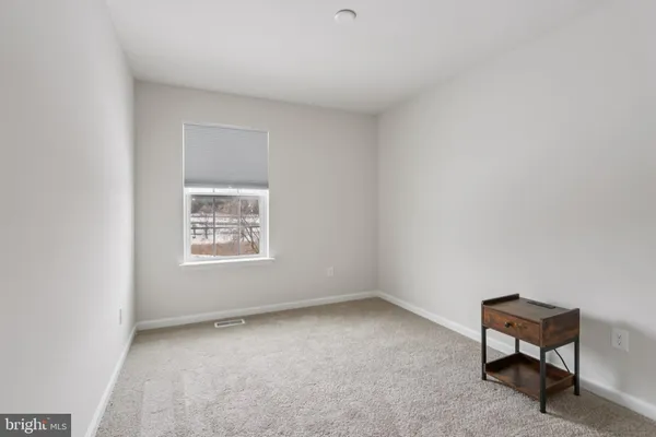 an empty room with a bench
