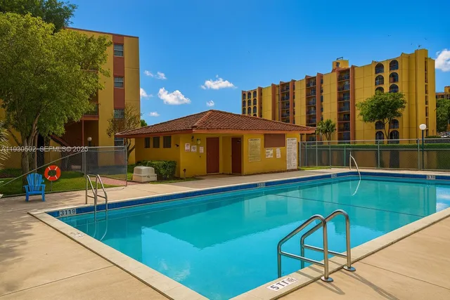 a view of a swimming pool with a lounge chairs