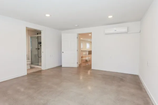a bathroom with a glass shower door