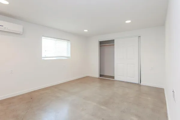 a bathroom with a sink toilet and mirror