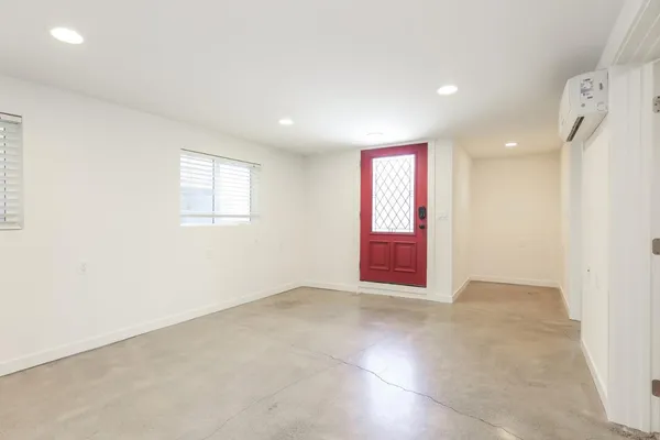 a view of an empty room and window