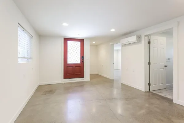 a kitchen with white cabinets and white appliances