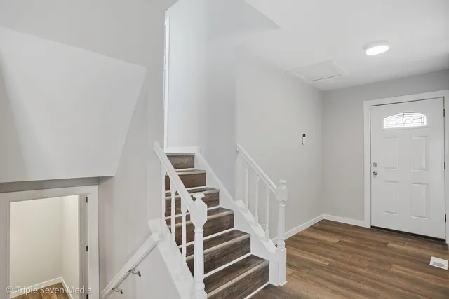 a view of entryway with wooden floor