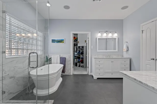 a bathroom with a sink a toilet and bathtub