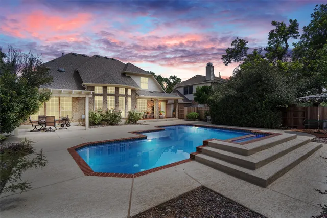 a view of a swimming pool with a lounge chairs