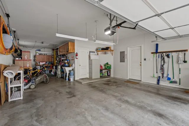 a view of a garage with rack and bicycle