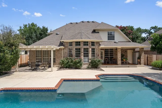 a view of house with yard outdoor seating area and barbeque oven