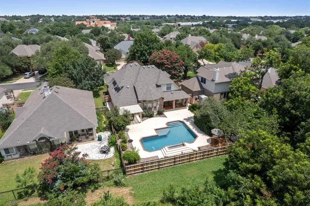 an aerial view of residential house with outdoor space