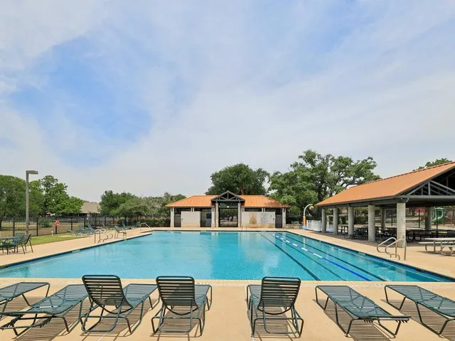 a view of a park with large trees