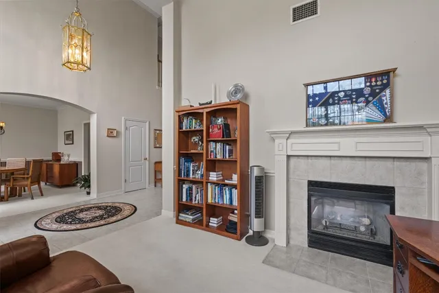 a living room with furniture and a fireplace