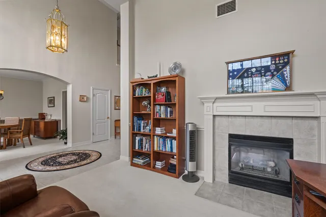 a living room with furniture and a fireplace
