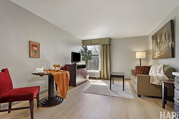 a view of a livingroom with furniture and a flat screen tv