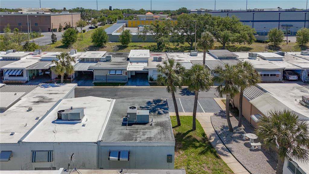 250 Rosery Road Northwest, Unit 228 Largo, FL 33770 - Photo 25 of 27 a picture of houses with outdoor space