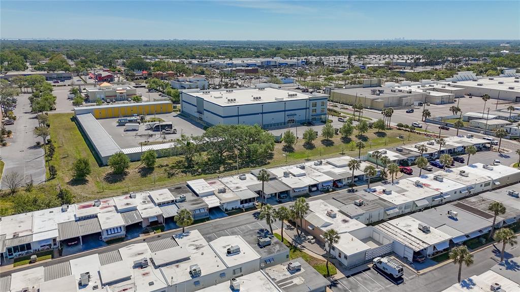250 Rosery Road Northwest, Unit 228 Largo, FL 33770 - Photo 26 of 27 an aerial view of a city with lots of residential buildings