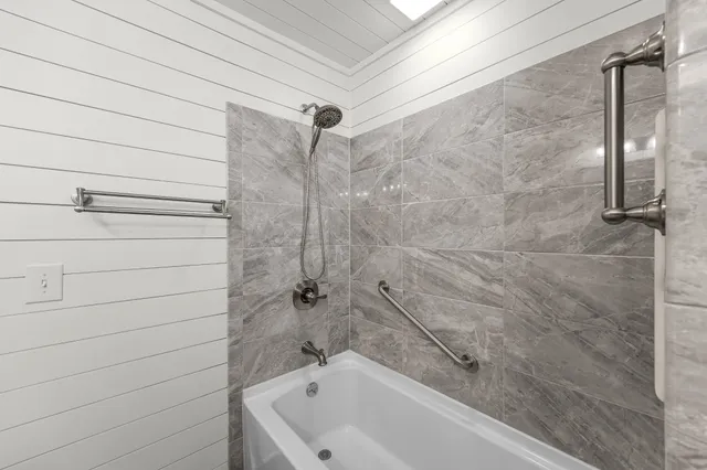 a view of a house with a yard and sitting area