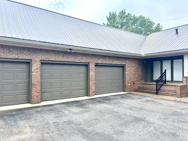 a house view with a sitting space and garden