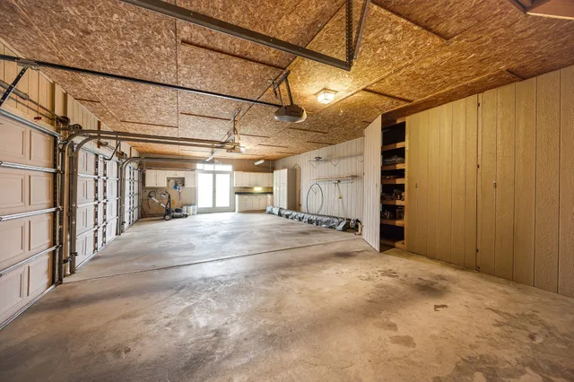 a front view of a house with swimming pool having outdoor seating