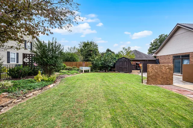a view of a house with a snow in the yard