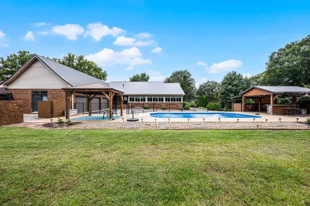 a backyard of a house with lots of green space