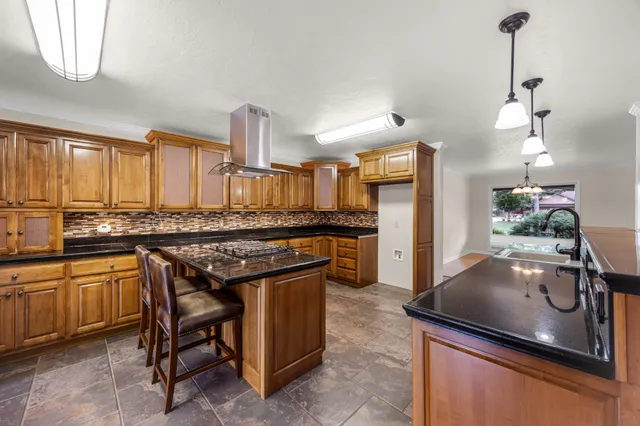 a view of empty room with window and wooden floor