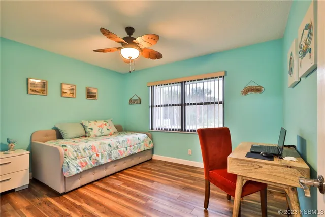 a bedroom with a bed and a chair