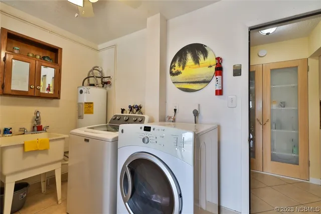 a view of a sink and washer and dryer