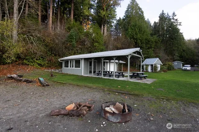 a view of a house with backyard porch and garden