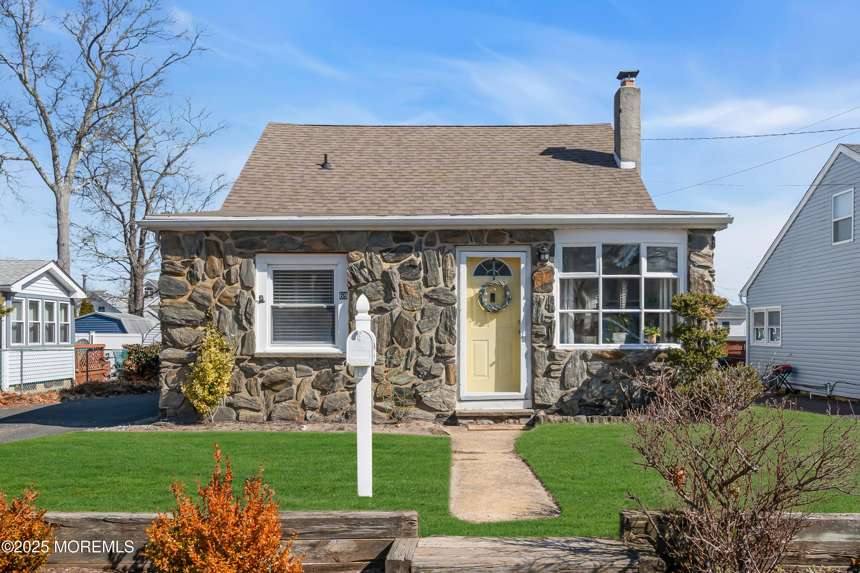 69 Pinehurst Road Brick, NJ 08723 - Photo 1 of 33 a front view of a house with garden