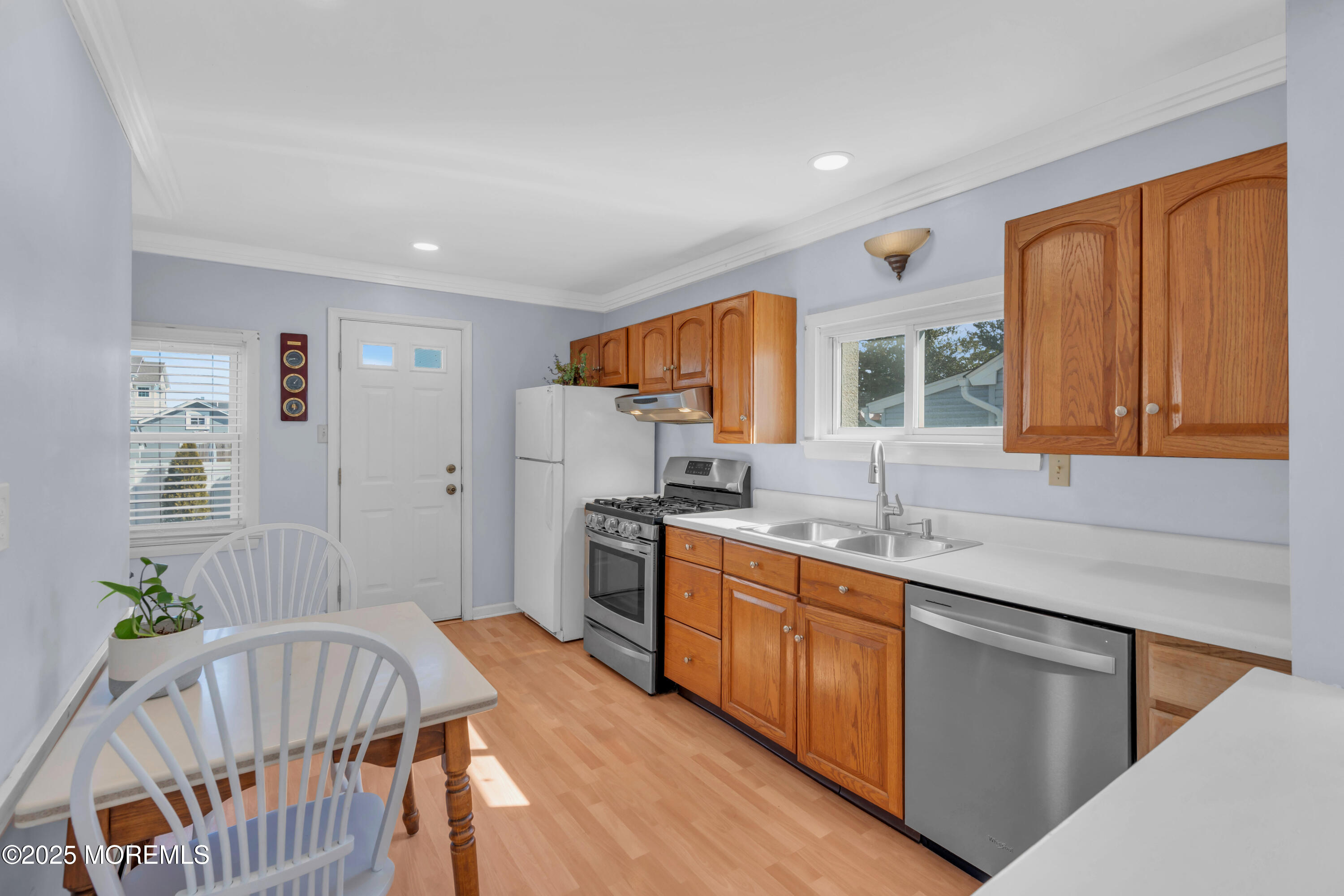 69 Pinehurst Road Brick, NJ 08723 - Photo 12 of 33 a kitchen with stainless steel appliances granite countertop a stove a sink and a refrigerator