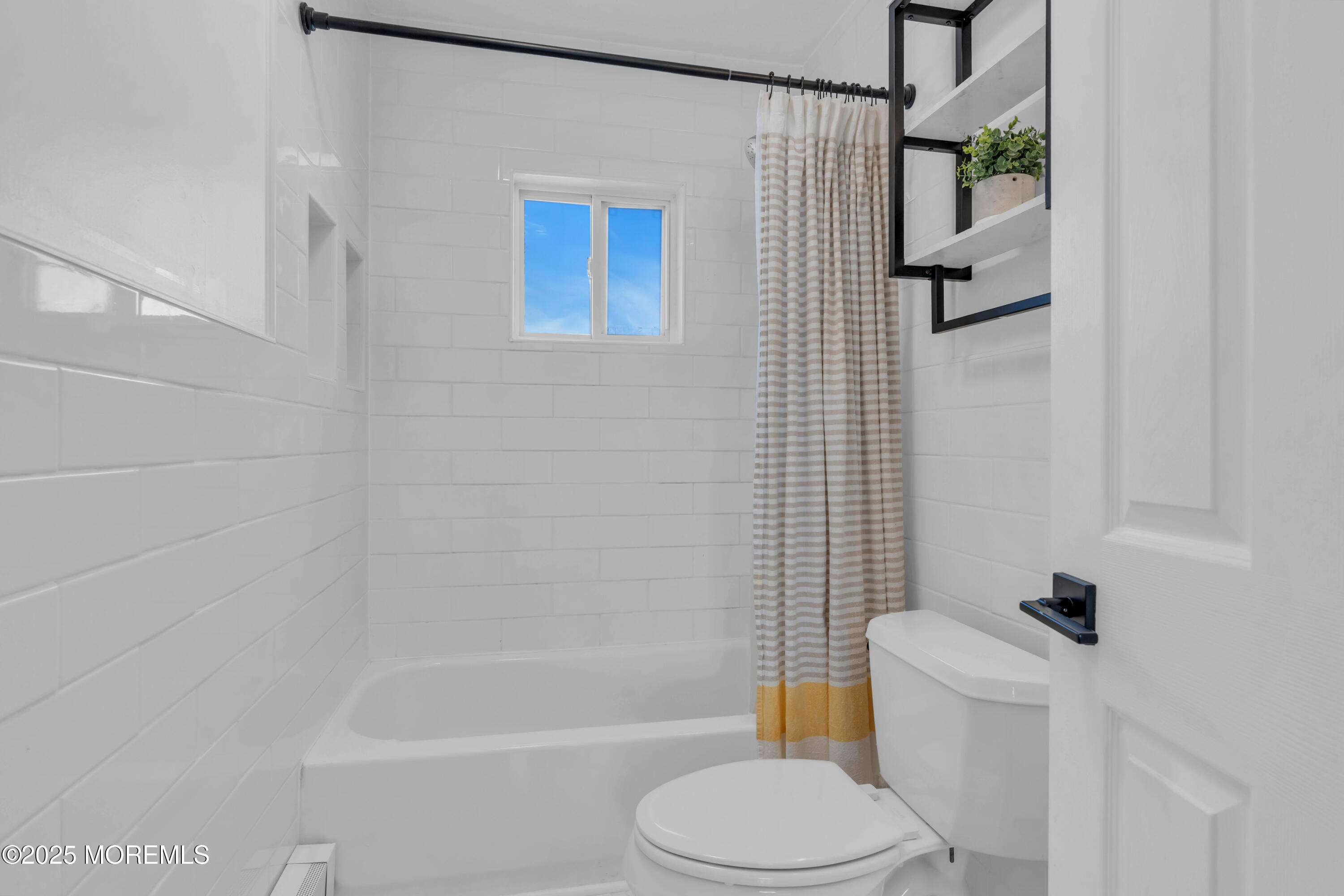 69 Pinehurst Road Brick, NJ 08723 - Photo 21 of 33 a white toilet sitting next to a bath tub