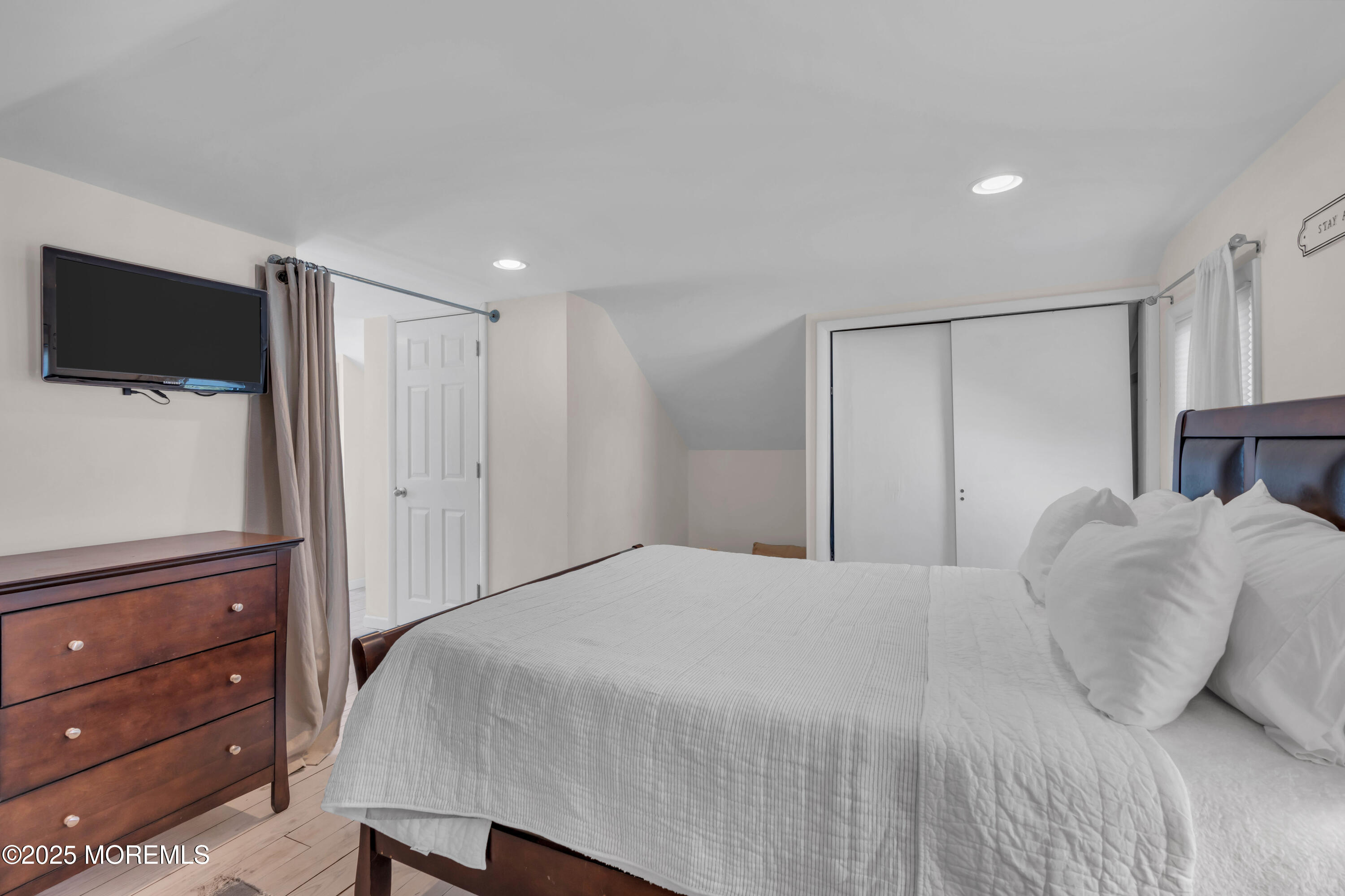 69 Pinehurst Road Brick, NJ 08723 - Photo 27 of 33 a bedroom with a bed and a flat screen tv