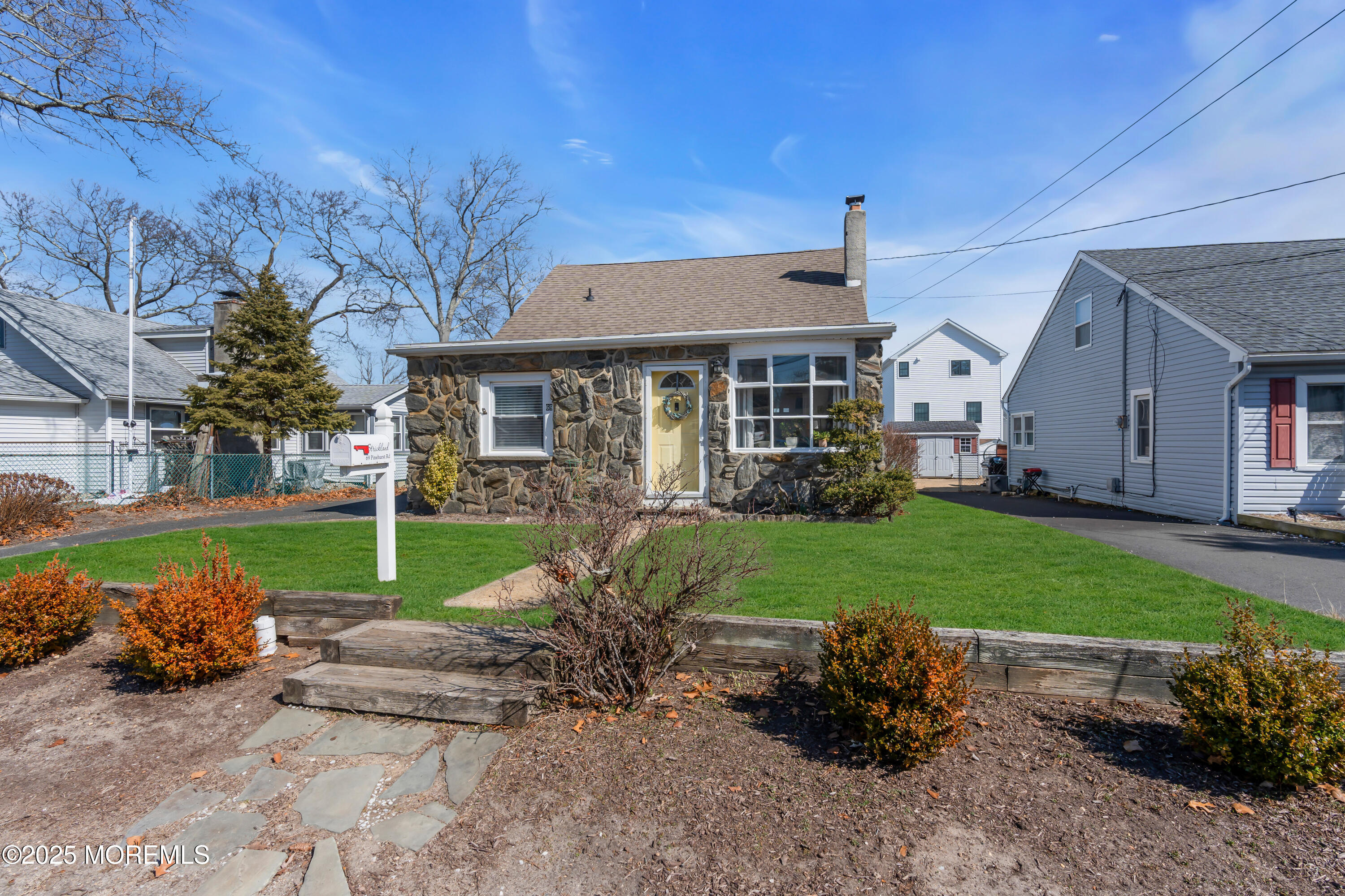 69 Pinehurst Road Brick, NJ 08723 - Photo 5 of 33 a house view with a garden space