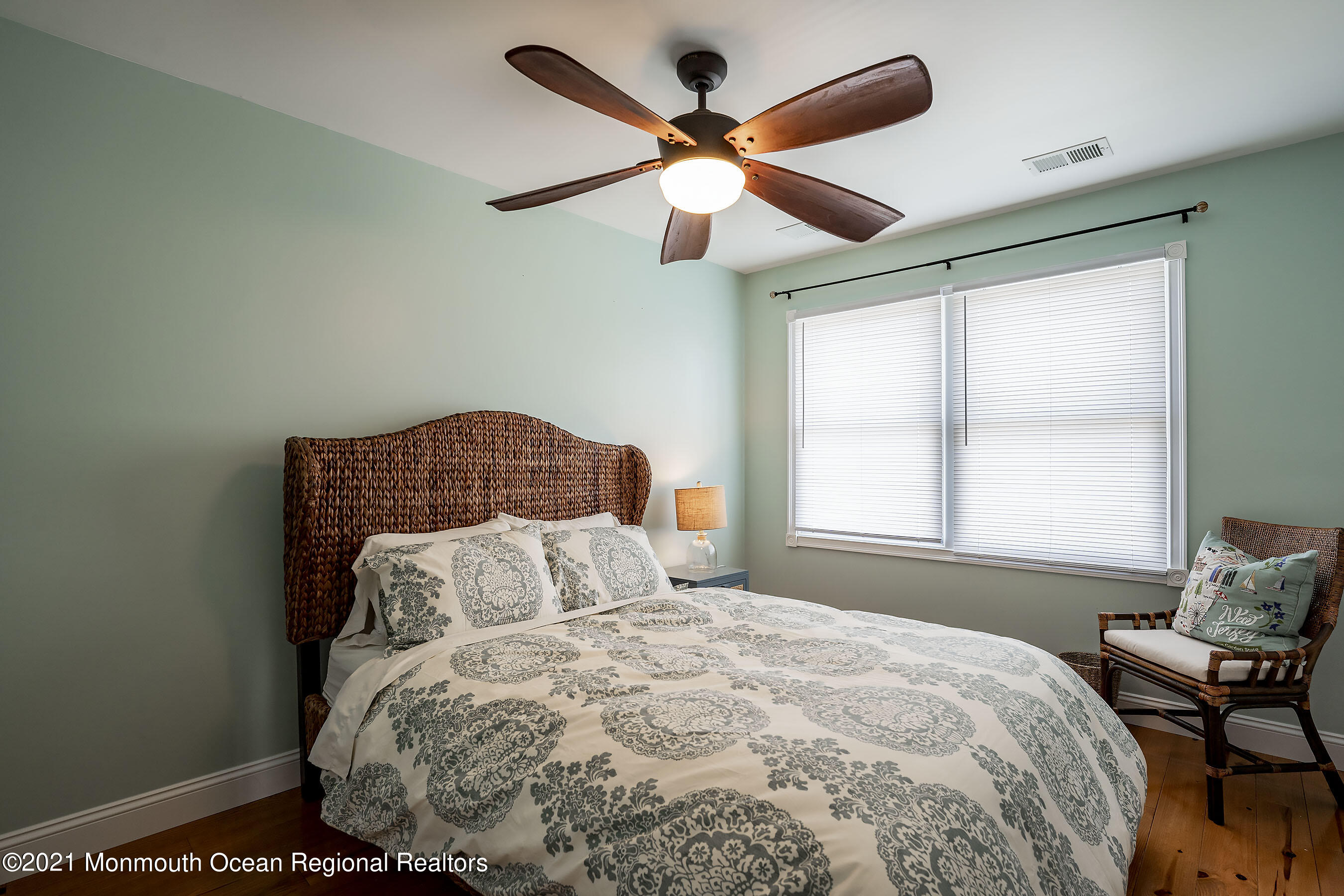 132 Sampson Place Long Branch, NJ 07740 - Photo 13 of 20 a bedroom with a bed and a ceiling fan