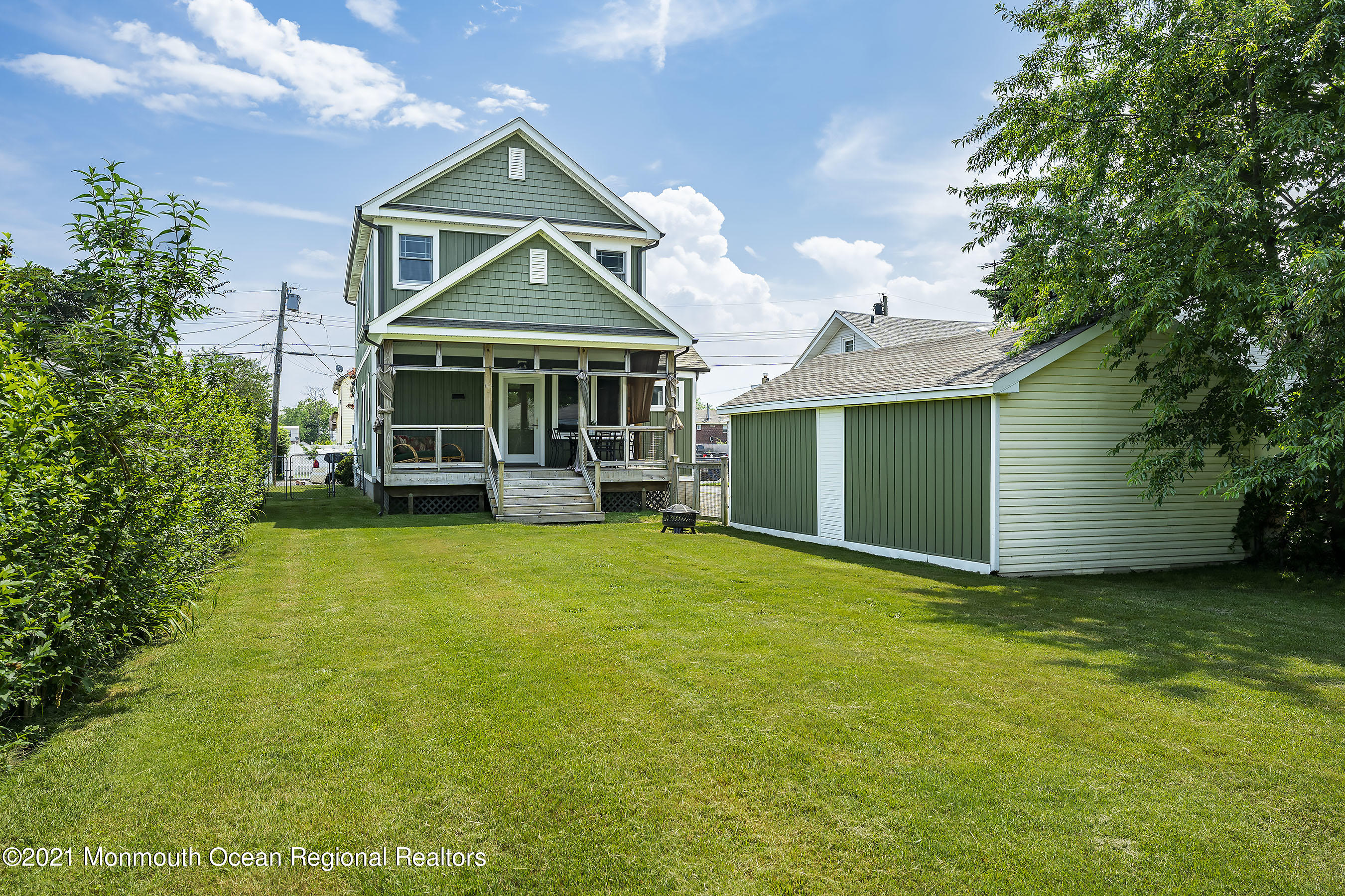 132 Sampson Place Long Branch, NJ 07740 - Photo 17 of 20 a front view of a house with a garden