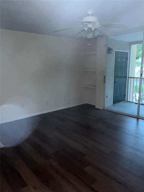 8939 Latrec Avenue, Unit 1205 Orlando, FL 32819 - Photo 4 of 15 wooden floor in an empty room