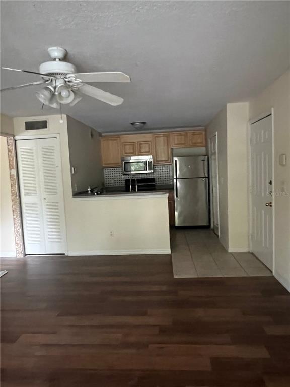 8939 Latrec Avenue, Unit 1205 Orlando, FL 32819 - Photo 8 of 15 a view of a kitchen with a sink and dishwasher