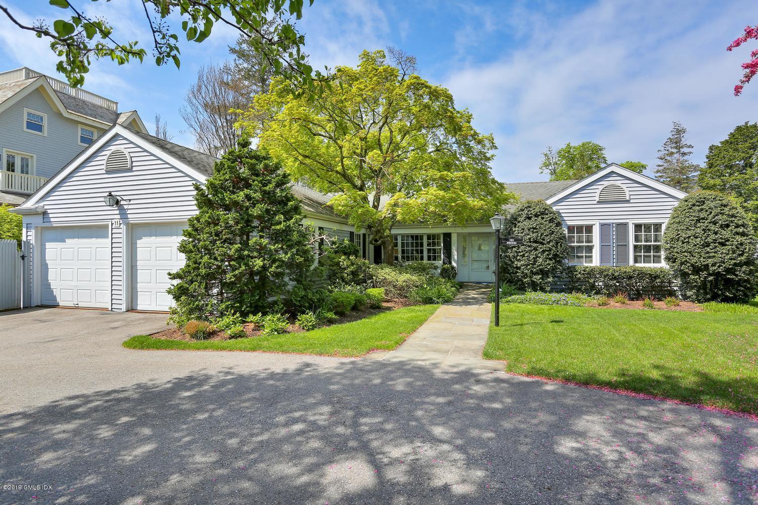 11 Wahneta Road Old Greenwich, CT 06870 - Photo 1 of 26 a front view of a house with a yard and garage